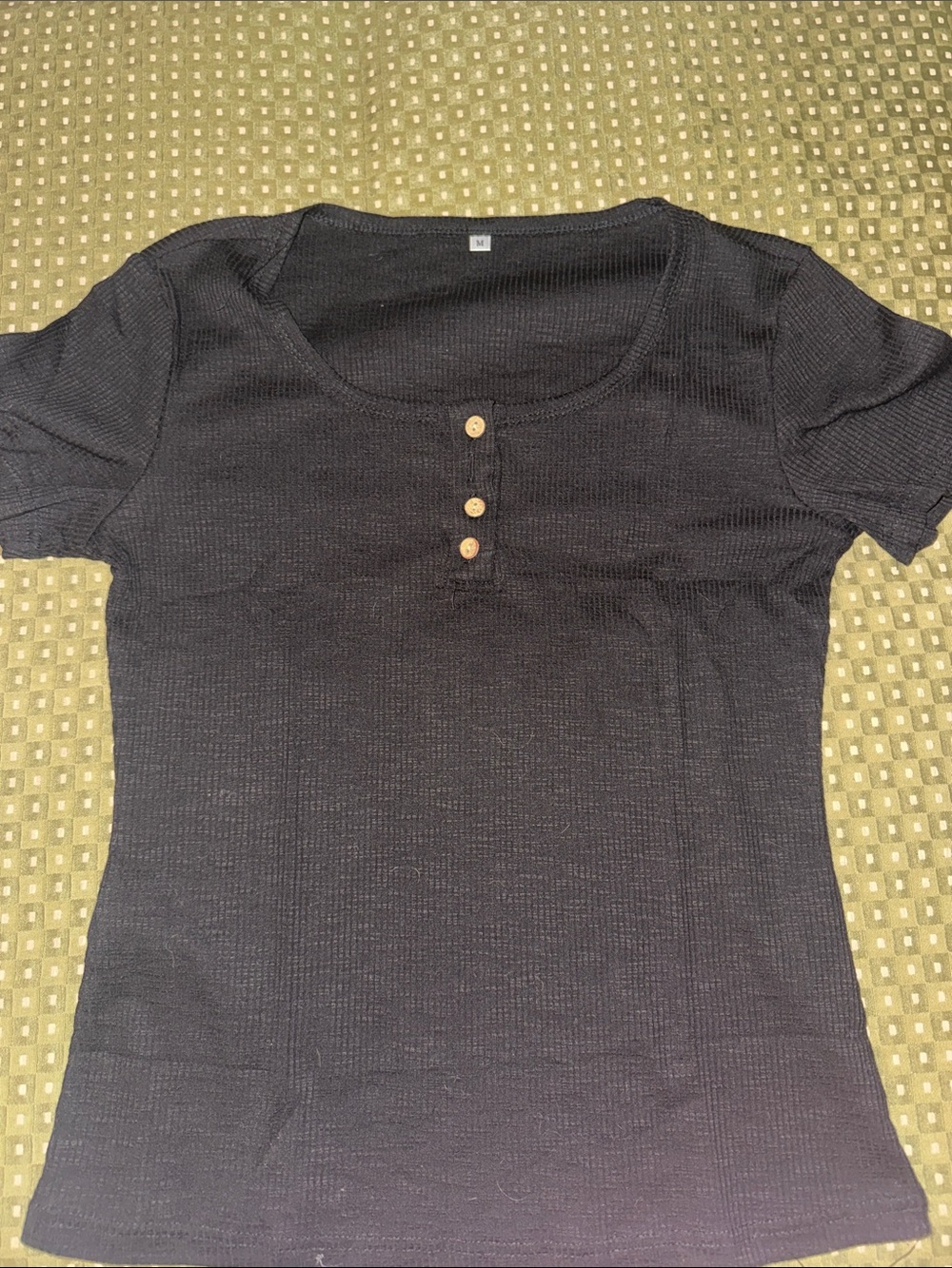 Black top with brown buttons, new without tags.